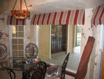 Awnings with scalloped edge, custom window treatments and drapery